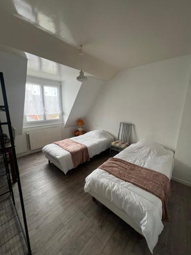 Postel nebo postele na pokoji v ubytování Chez Papy et Mamie