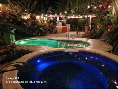 a swimming pool in a yard at night at San Gabriel Apartments in Fortuna