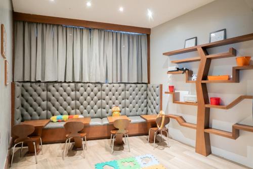 a dining room with a table and chairs at Hilton Porto Alegre, Brazil in Porto Alegre