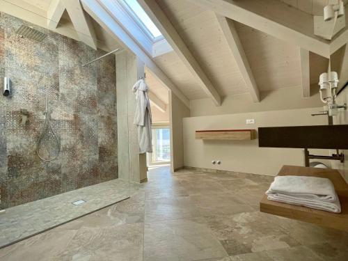 a bathroom with a shower and a sink at Pietralunga Resort in Fidenza