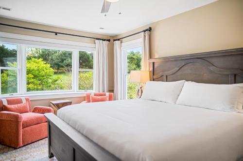 a bedroom with a large bed and a chair at Inn at Brierley Hill in Lexington