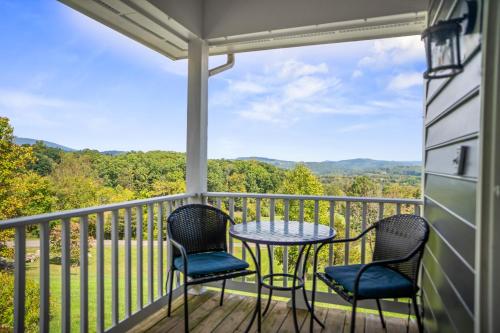 a patio with two chairs and a table on a balcony at Inn at Brierley Hill in Lexington