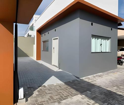 a rendering of a house with a driveway at Apartamentos novos em condomínio no Caçari in Boa Vista