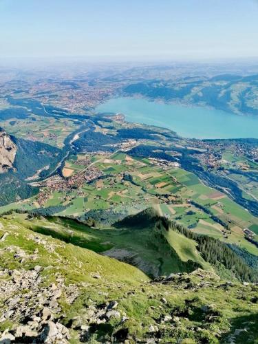 an aerial view of a golf course on top of a mountain at Chalet-Simmi in Wimmis