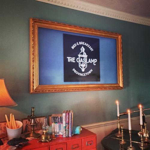 a framed picture of the chesamp on a wall at The Gaslamp Bed and Breakfast in Provincetown