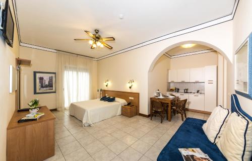 a hotel room with a bed and a table at Hotel Nettuno in Lido di Jesolo