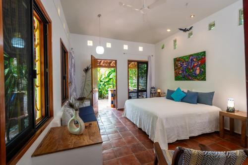 a bedroom with a bed in a room at Hotel Villa Mozart y Macondo in Puerto Escondido