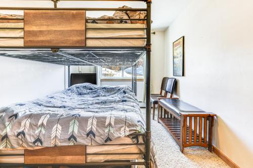 a bedroom with two bunk beds and a desk at Dillon Reservoir On-Site Central and Scenic Condo! in Dillon