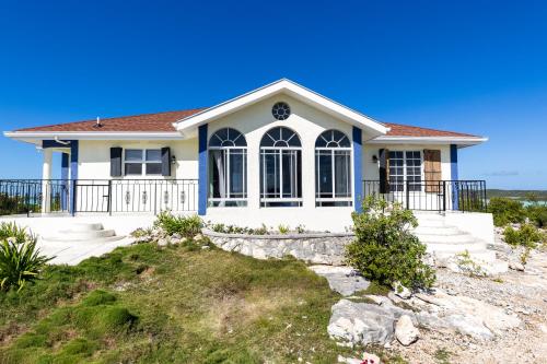 a house on the beach at Waterside Home, Shaded Whirlpool Spa, Outdoor Dining, Smart TV, Amazon Prime in Providenciales