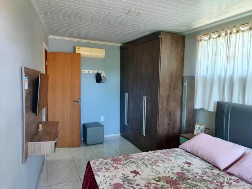 Ένα ή περισσότερα κρεβάτια σε δωμάτιο στο Casa José Gonçalves Buzios