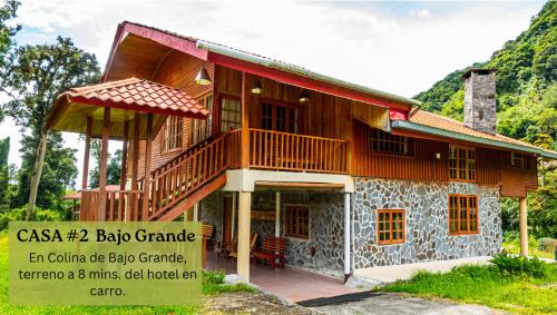 a house with a large balcony on the side of it at Los Quetzales Ecolodge & Spa in Cerro Punta