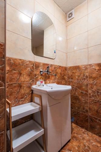 a bathroom with a sink and a mirror at D.W uMiescorza in Białka Tatrzańska