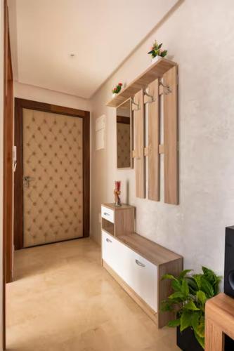 a room with a closet with a door and a room with at Casa Lilas Free Parking & Gym & Optical Fiber Oldtown 5 mn Walk in Rabat