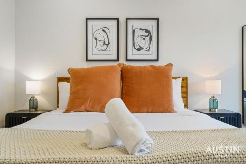 a bedroom with a white bed with two lamps at Brand New Studio Apt w King Bed Kitchenette in Steiner Ranch by Austin Vacay in Austin