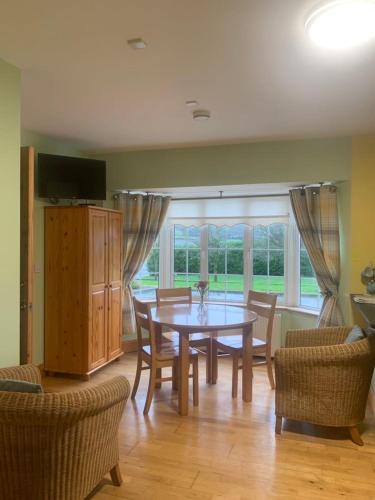 a dining room with a table and chairs at Kate's Rest in Kilkenny