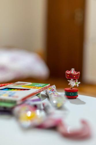 a toy figurine sitting on top of a table at The Lily Nest in Lilí
