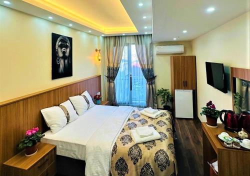 a bedroom with a large bed in a room at Hotel By Historia in Istanbul