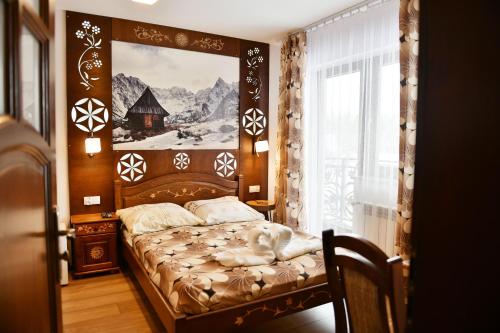 Ένα ή περισσότερα κρεβάτια σε δωμάτιο στο Pokoje u Wojtanka-zniżki na termy