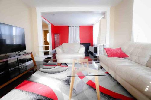 a living room with a white couch and a glass table at Mount Pleasant Hideaway in Providence