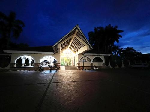 a large white building with a light shining on it at Tequendama Hotel Campestre Villavicencio in Villavicencio