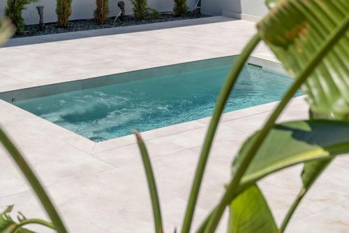 a swimming pool in the middle of a yard at Chania Urban Living - Live like a local in Chania Town