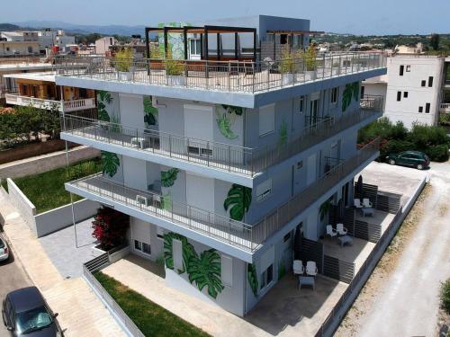 an apartment building with plants on the balconies at Chania Urban Living - Live like a local in Chania Town