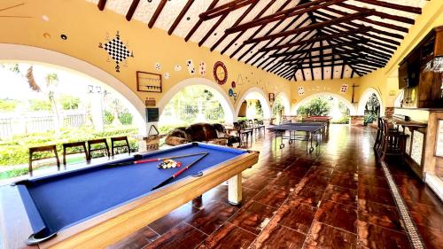 a large room with a pool table in it at Tequendama Hotel Campestre Villavicencio in Villavicencio