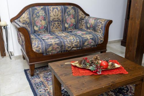 a living room with a couch and a coffee table at River Hotel in Castel di Sangro