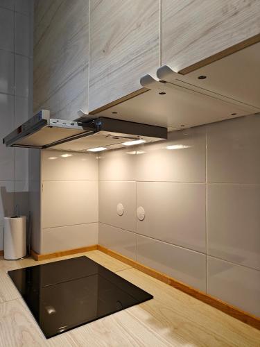 a kitchen with a ceiling with a stove at Carnide 1913 E - 1BR apt in Lisbon
