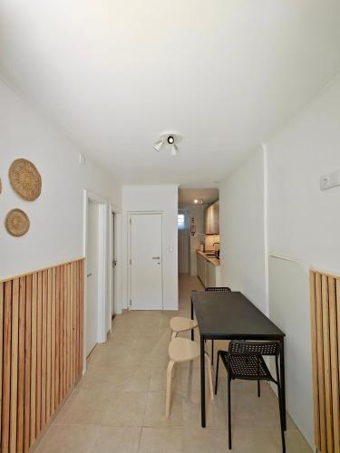 a kitchen and dining room with a table and chairs at Carnide 1913 E - 1BR apt in Lisbon
