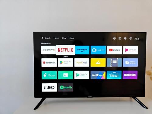 a television screen with a bunch of apps on it at The Ceramic - 2BR apt in Lisbon