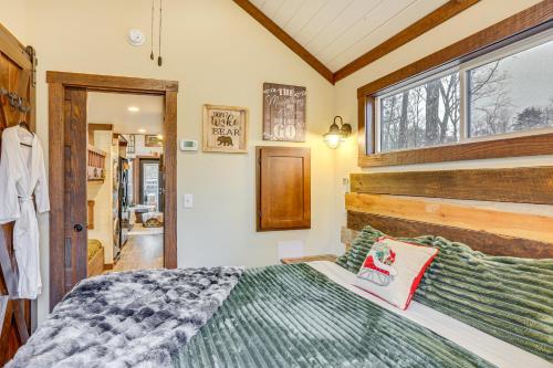 a bedroom with a bed and a window at On-Site Trails and Furnished Deck Monteagle Escape! in Monteagle