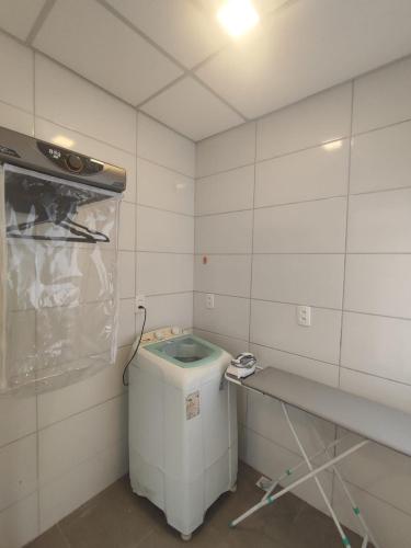 a small white room with a sink in it at VILLA BILAC - Studios próximo à Vila Germânica Bairro da Velha in Blumenau