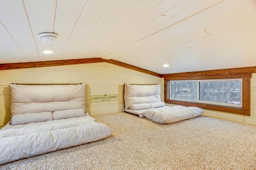 two beds in the corner of a room at On-Site Trails and Furnished Deck Monteagle Escape! in Monteagle