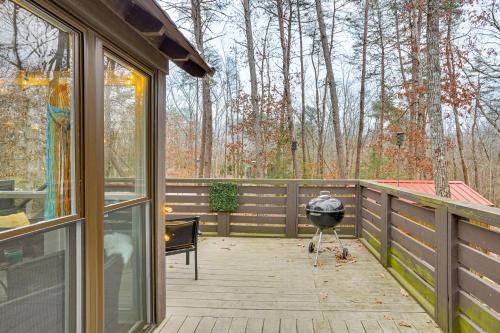 a screened in porch with a grill on a deck at On-Site Trails and Furnished Deck Monteagle Escape! in Monteagle