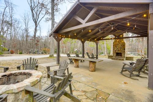 a pavilion with benches and a picnic table and a fireplace at On-Site Trails and Furnished Deck Monteagle Escape! in Monteagle