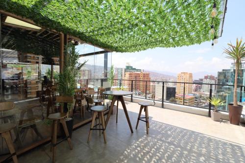 a restaurant with a view of the city at Madero Hotel & Suites in La Paz