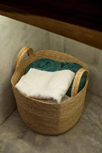 a basket filled with towels sitting under a table at Witari Hotel Boutique in San Francisco