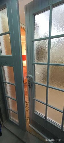 an open door with a window in a room at Bella vista Šumarice in Kragujevac