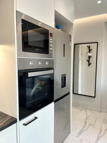 Η κουζίνα ή μικρή κουζίνα στο BlueLine apartment 1