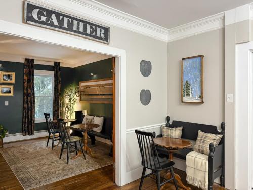 a dining room with a table and chairs at The Aurora Inn & Cottages in Bartlett