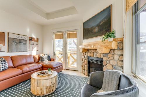 a living room with a couch and a fireplace at Walk to Lifts Copper Mtn Condo in Center Village in Frisco
