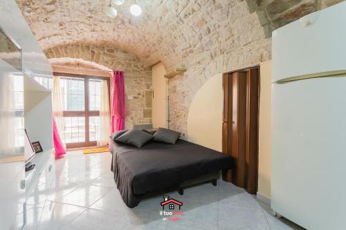 A bed or beds in a room at Just Music House bnb,typical,15min airport & beach