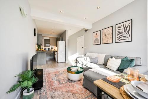 a living room with a couch and a table at Long Stays Angel Apartment with Terrace in London