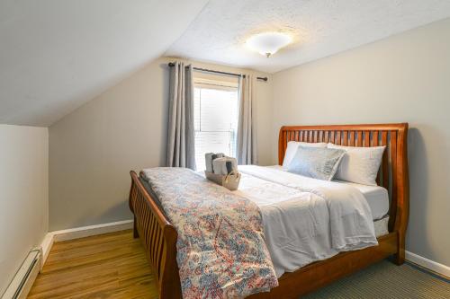 a bedroom with a bed and a window at Home Near Skiing and Downtown Worcester in Worcester