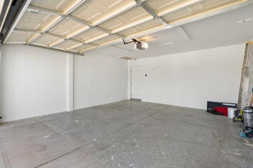 a garage with white walls and a concrete floor at Central Tempe Gem Mural Art Garage Near Freeway in Tempe