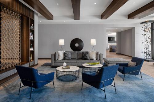 a living room with a couch and chairs at AC Hotel by Marriott Santa Rosa Sonoma Wine Country in Santa Rosa