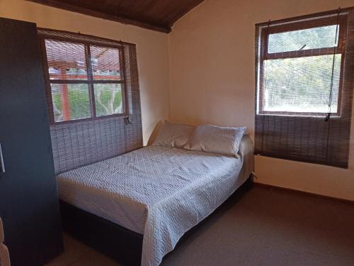 Ένα ή περισσότερα κρεβάτια σε δωμάτιο στο Alojamiento Los Alpes