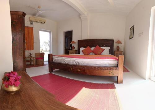 a bedroom with a large bed in a room at Savista Retreat in Jaipur