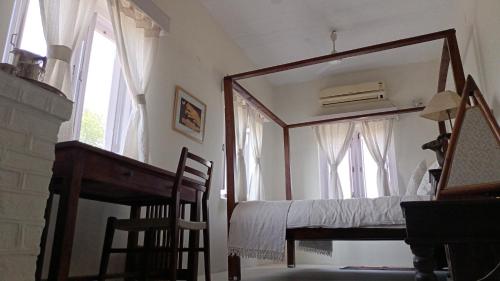 a mirror in a room with a bed and a window at Savista Retreat in Jaipur